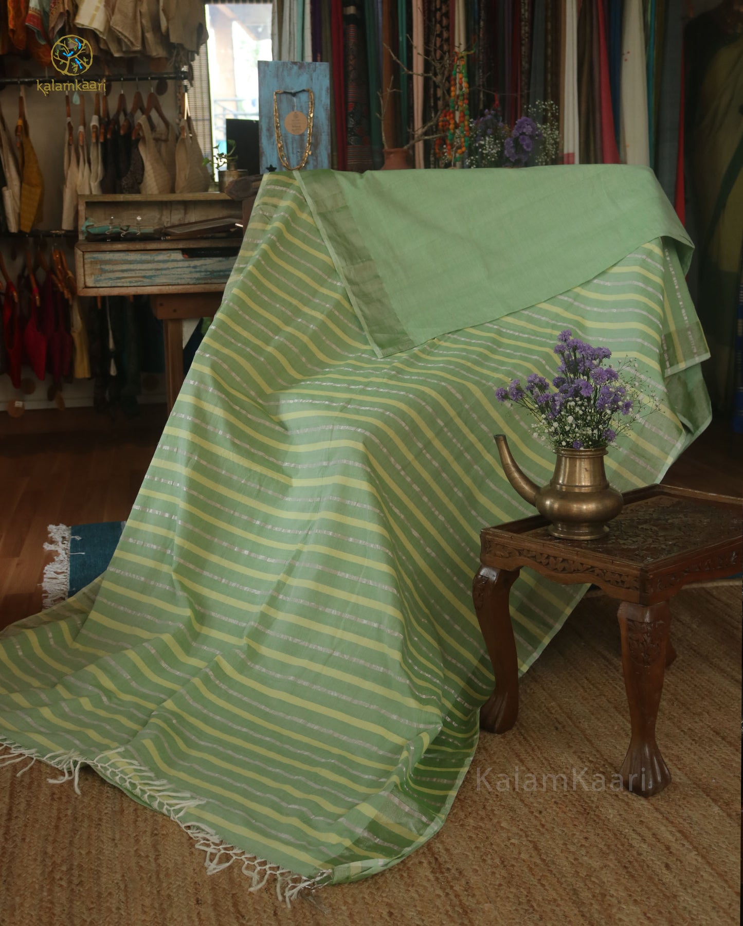 Lime green colored Kasavu saree