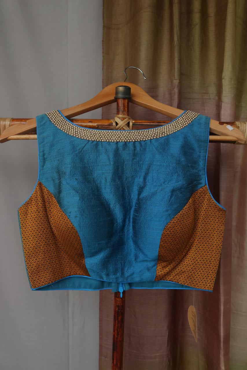 Raw silk blouse with pearl embroidery